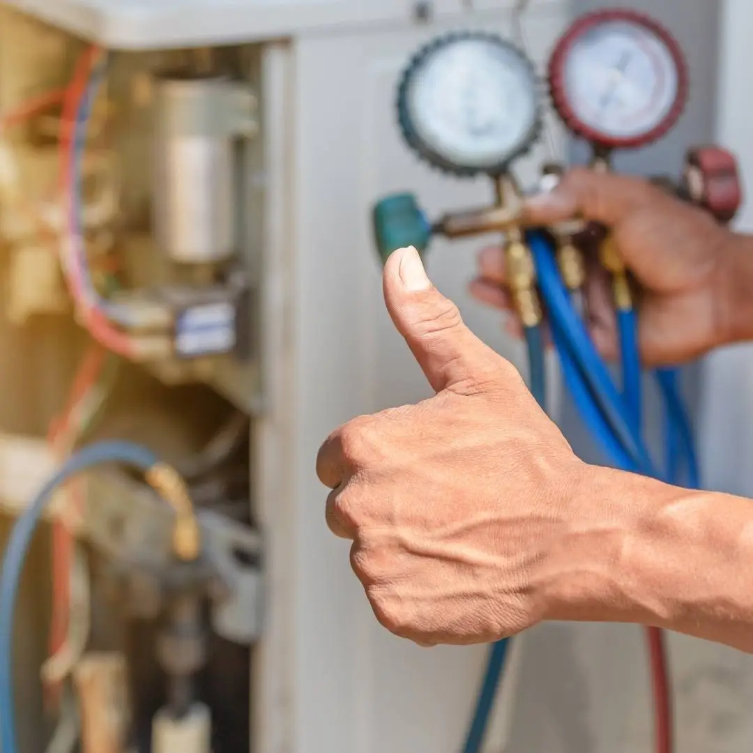 Technician performing seasonal HVAC maintenance