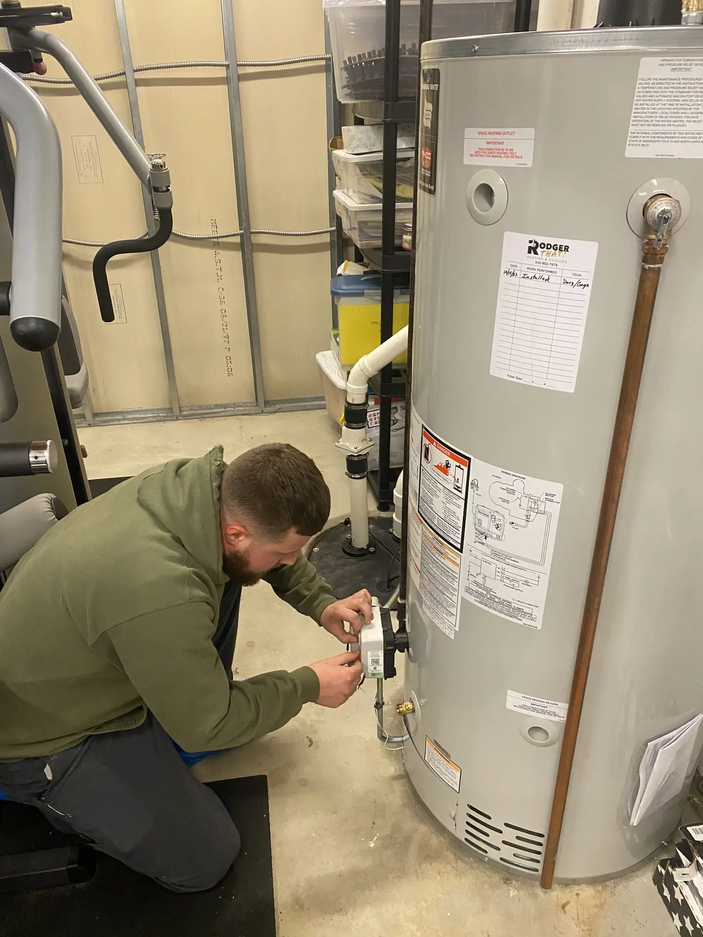 Rodger That technician installing a hot water tank