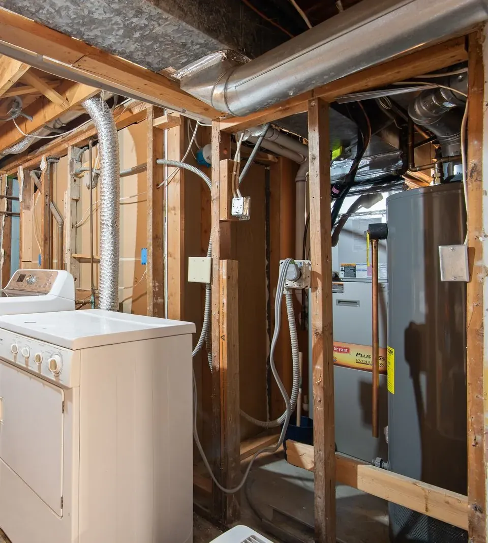 New high-efficiency gas furnace installed in a clean basement