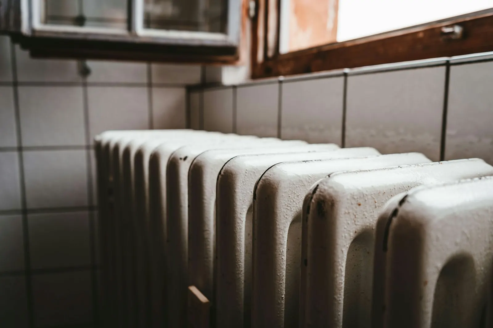Cast iron radiator under a window in an older Akron home