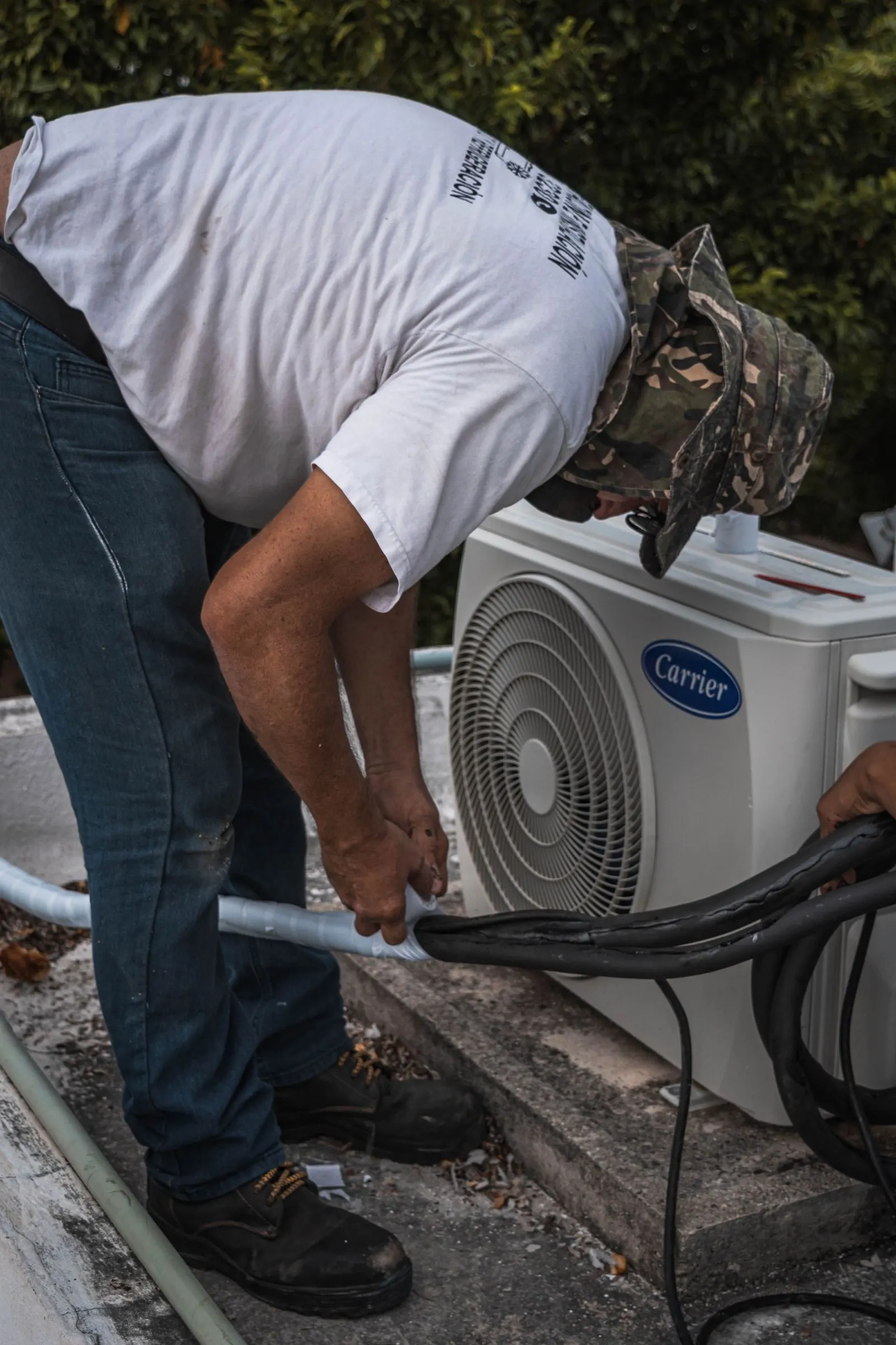Technician working on HVAC equipment at a small business