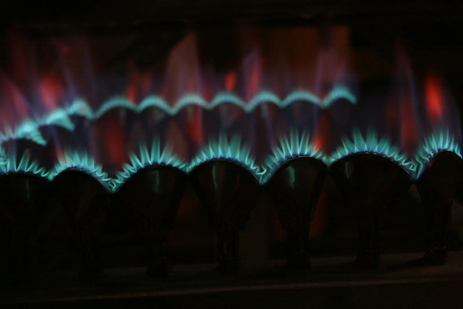 Technician replacing a furnace igniter