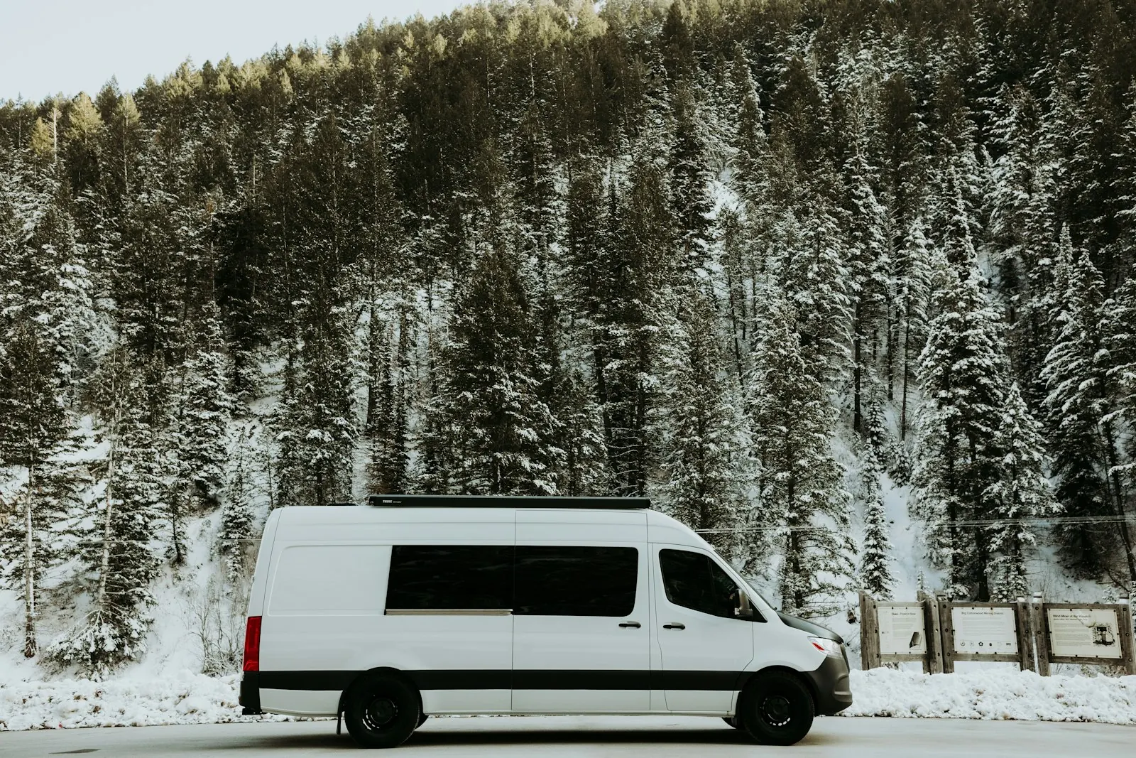 Service van parked outside an Akron home on a snowy evening
